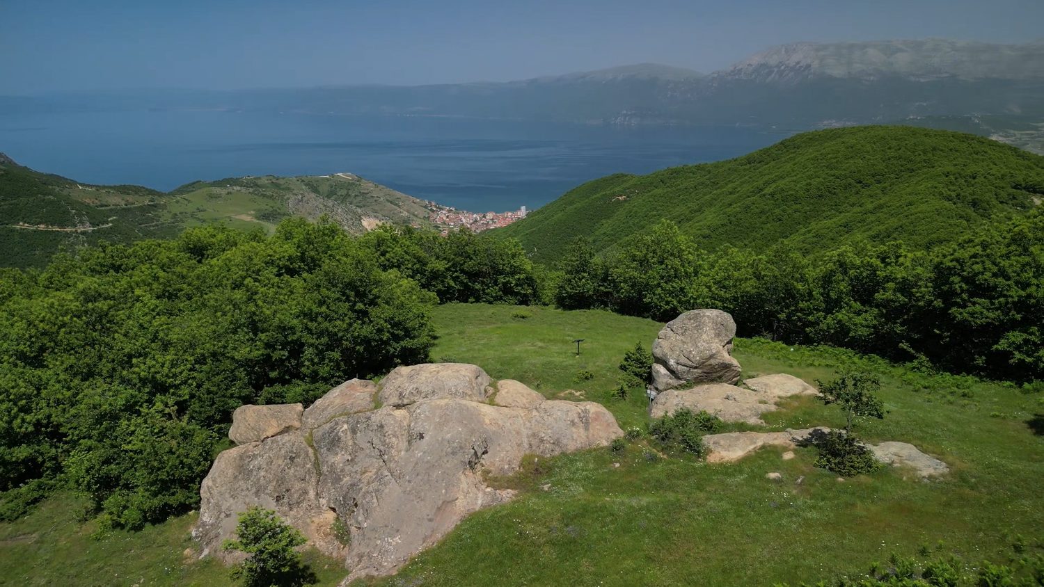 Rock formations on the Kabash Trail with Lake Ohrid and the mountains behind